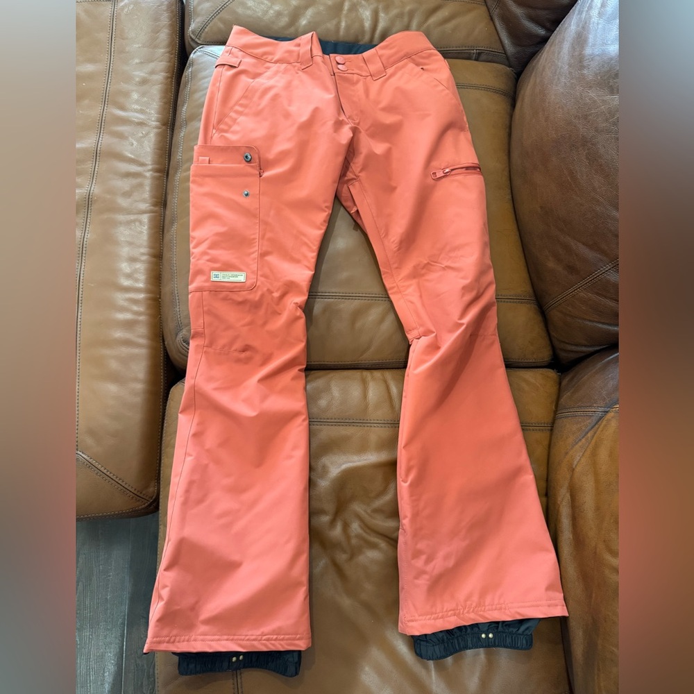 DC snowboarding pants. Coral-reddish color. Wore for one ski trip.